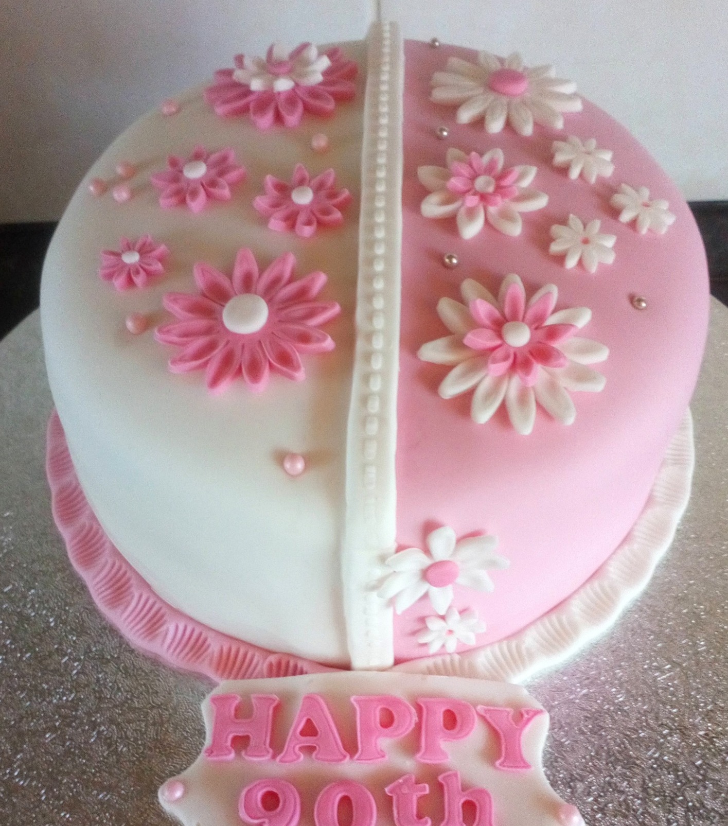 ladies pink and white 90th birthday cake