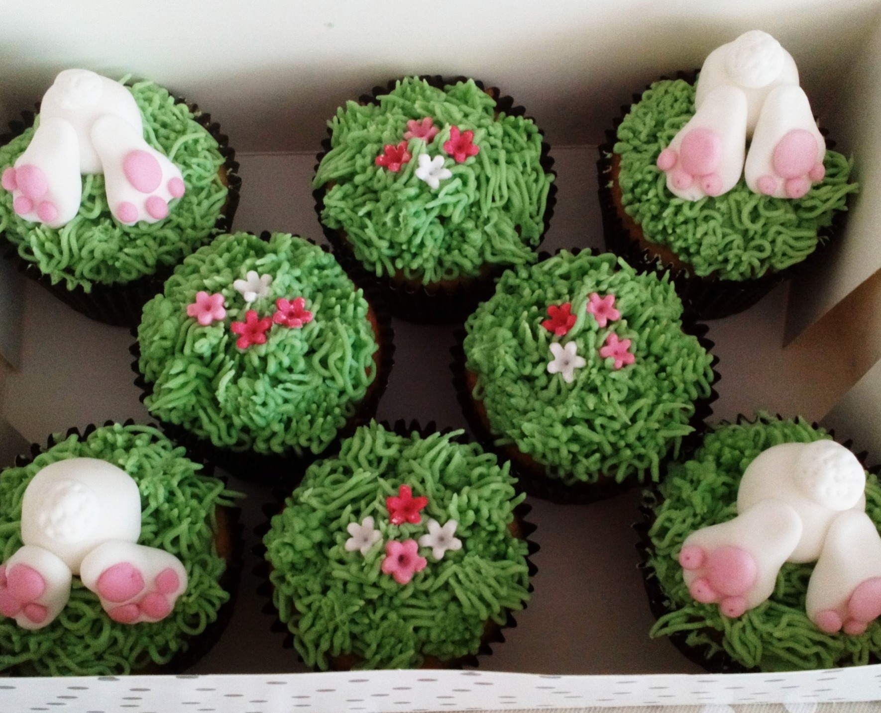 Box of 8 Easter bunnies in the grass cupcakes