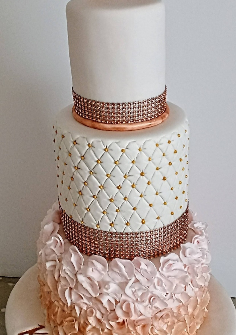 3 tier wedding?birthday cake with ruffles and rose gold design