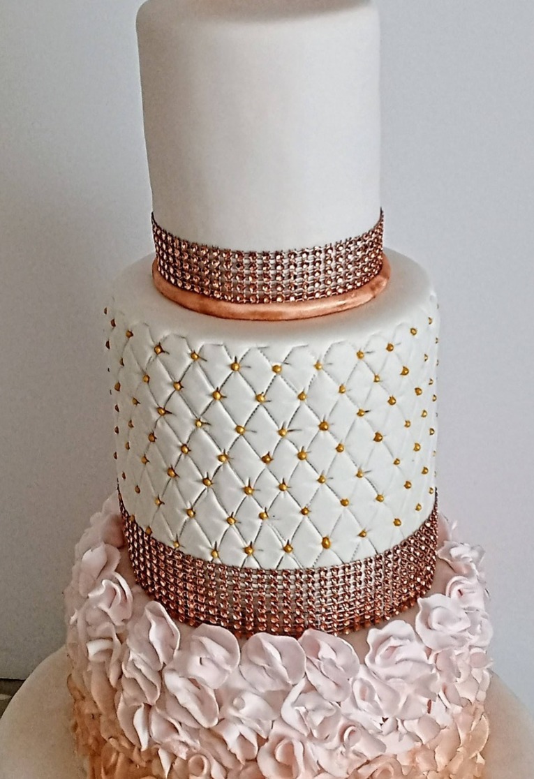 3 tier wedding cake with rose gold detail, ruffles and quilting
