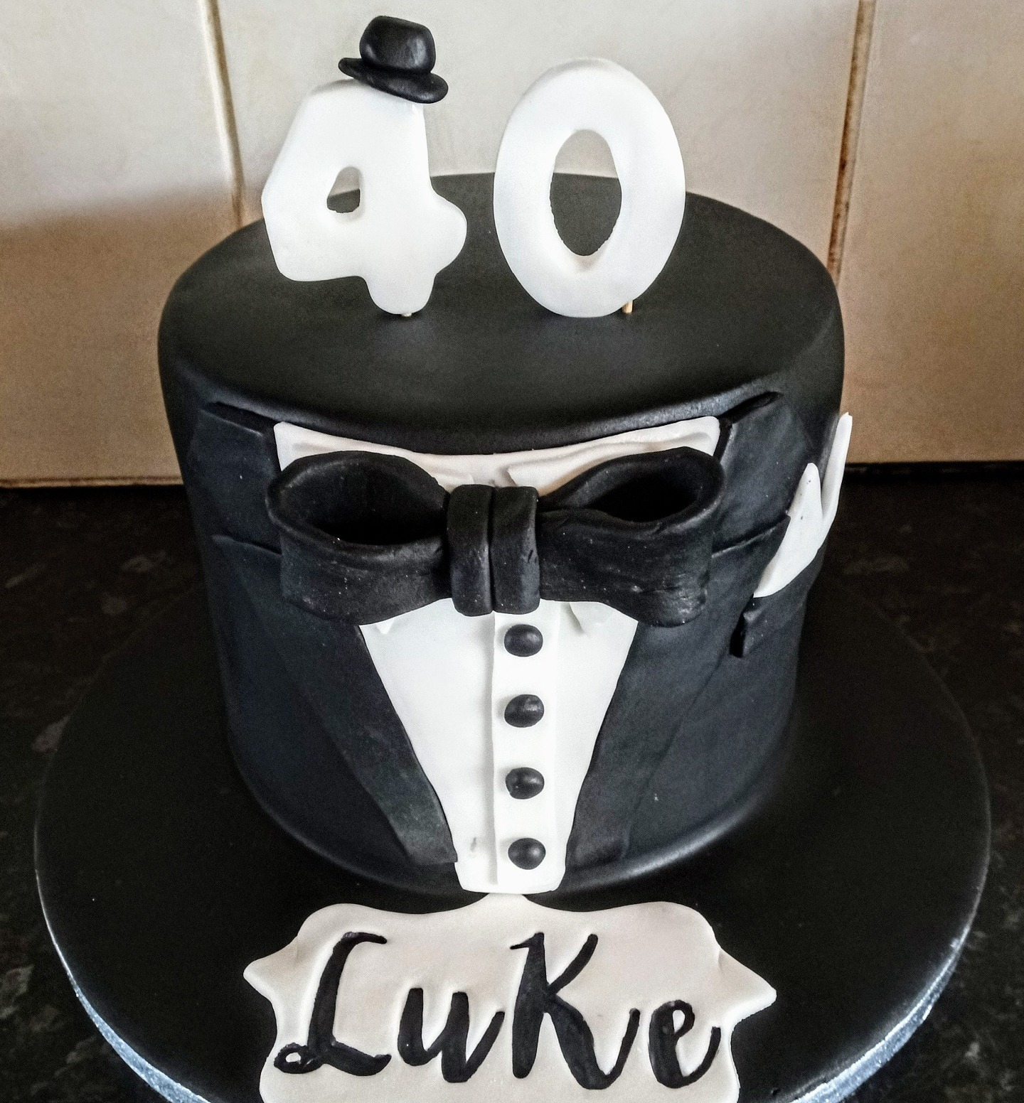 Mens 40th birthday black and white tuxedo cake