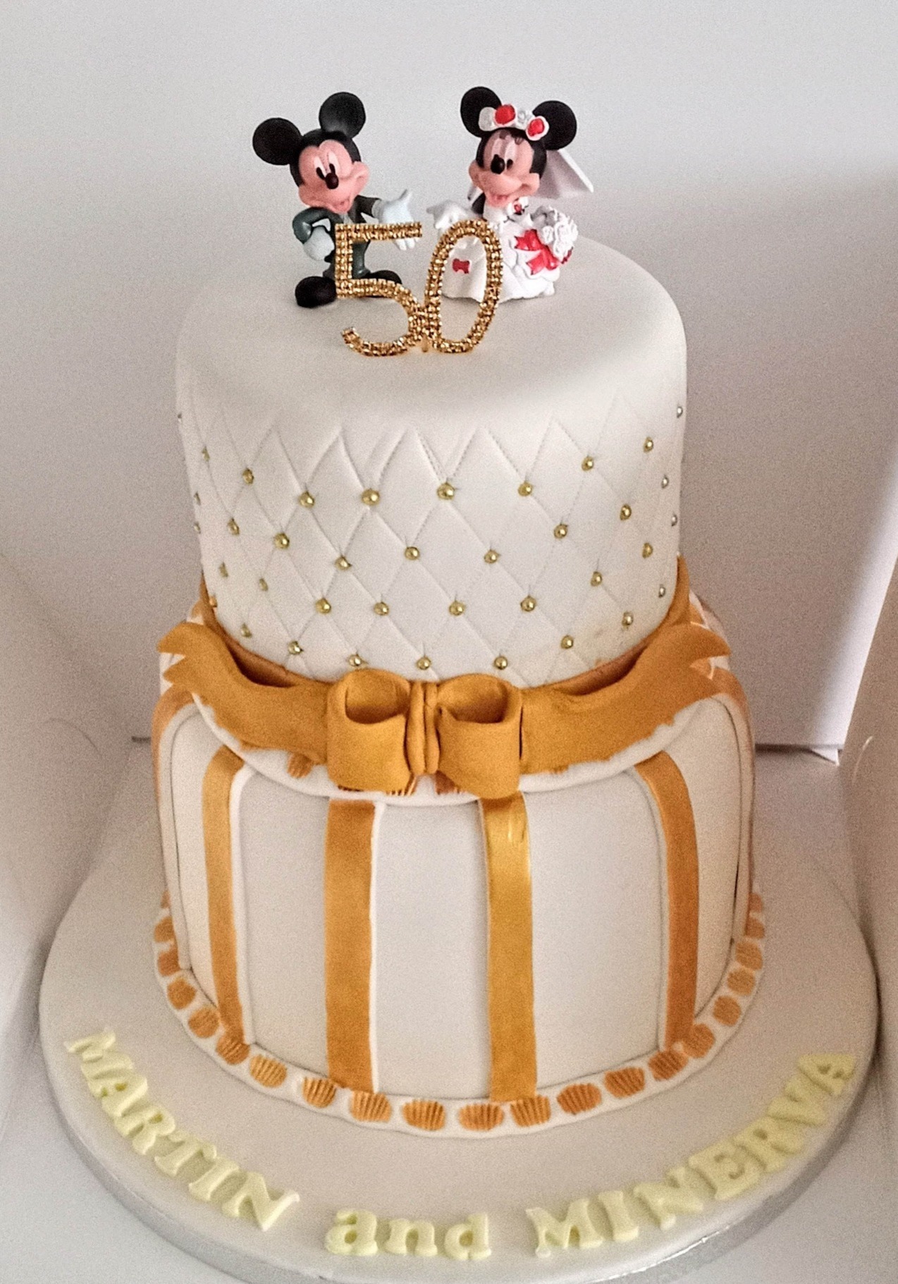 2 Tier wedding cake, white and gold with topper
