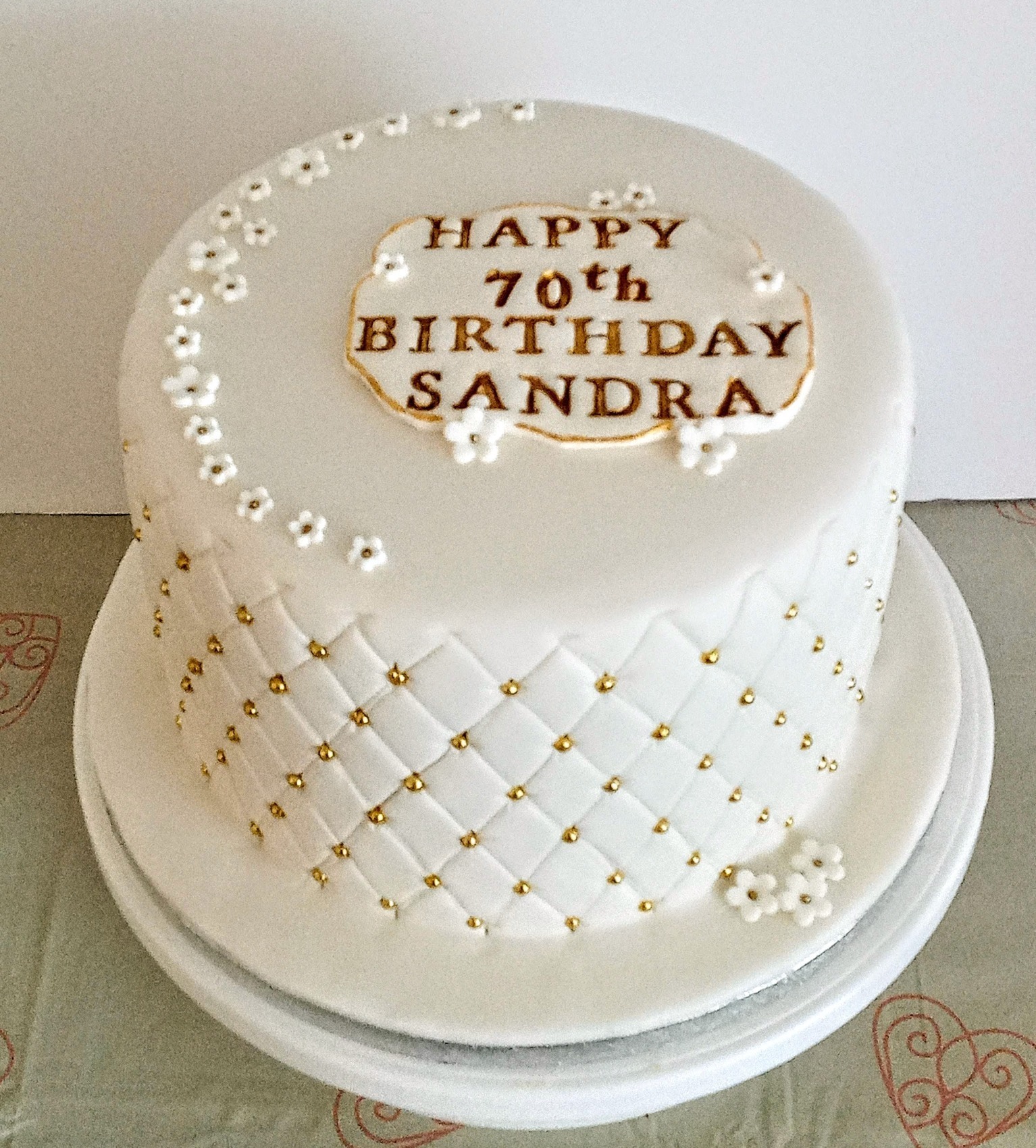 Ladies white and gold 70th birthday cake