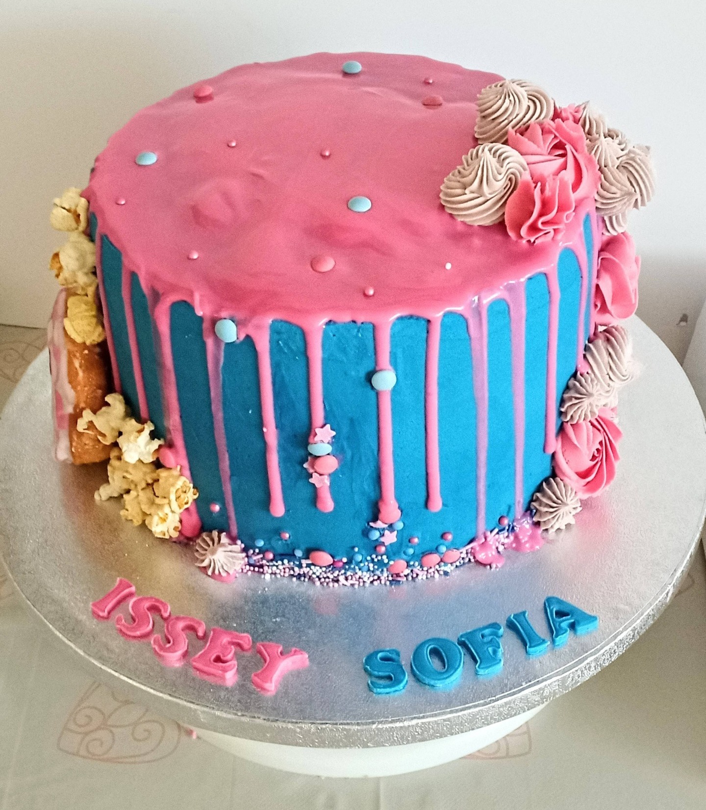 Twin girls pink and blue drip cake