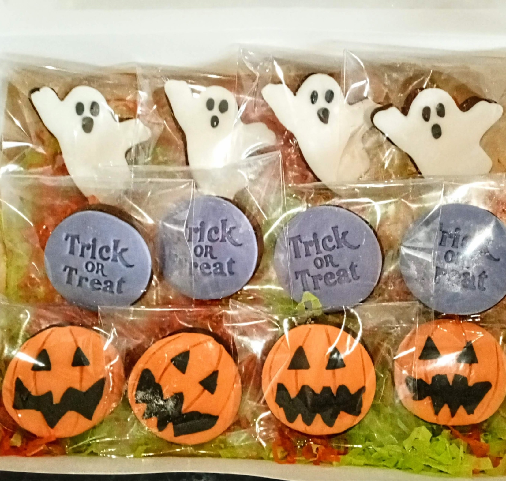Box of iced halloween biscuits