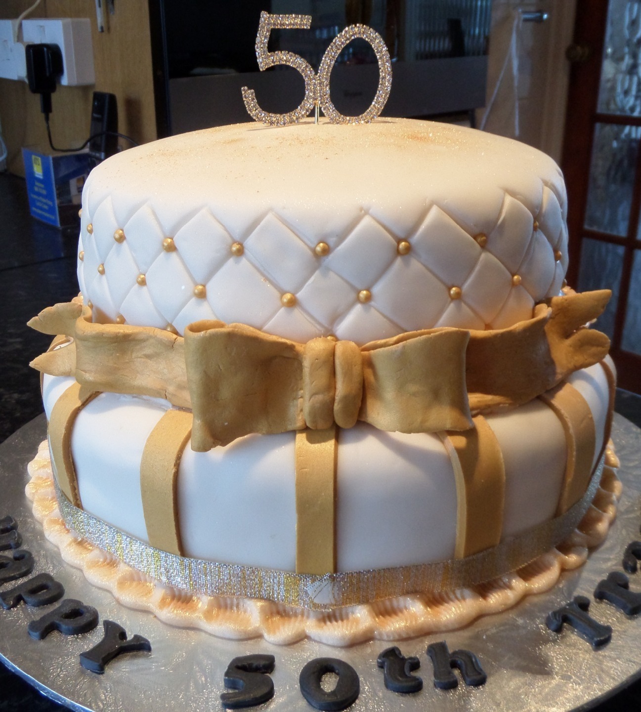 Ladies 2 tier 50th birthday cake , white and gold