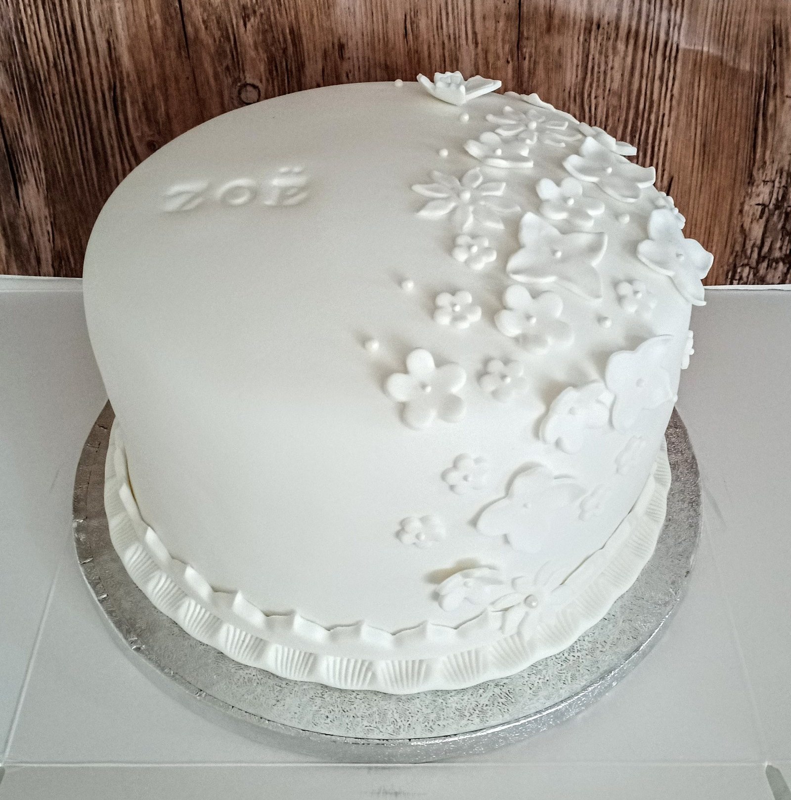 Elegant plain white floral birthday cake