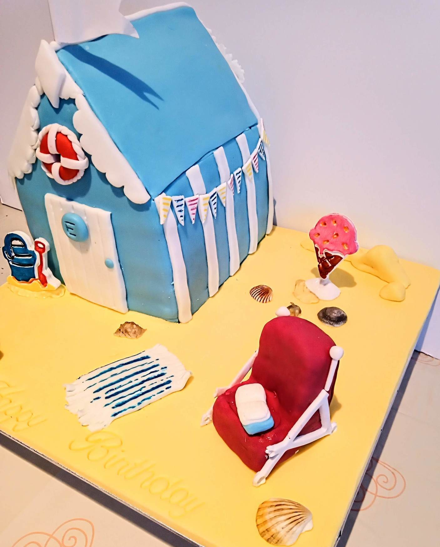 Beach hut shaped birthday cake