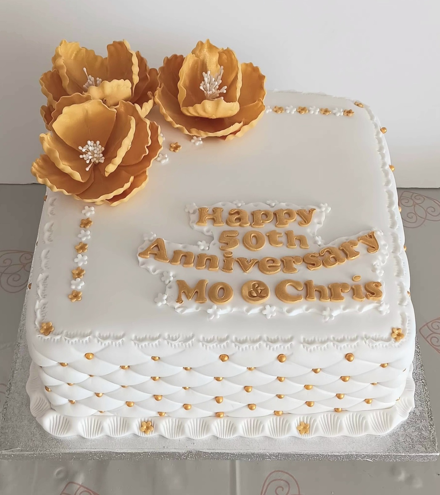 Golden wedding Anniversary cake with gold sugar peonies