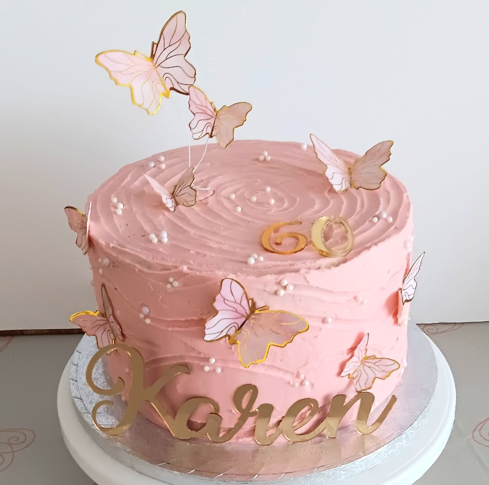 a 60th pink butterfly cake