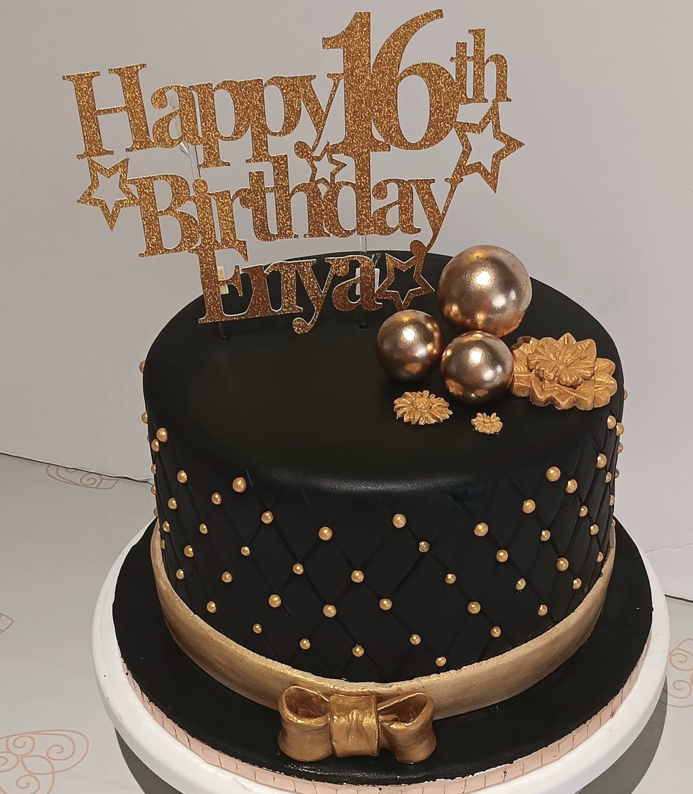 Black and gold 16th birthday cake