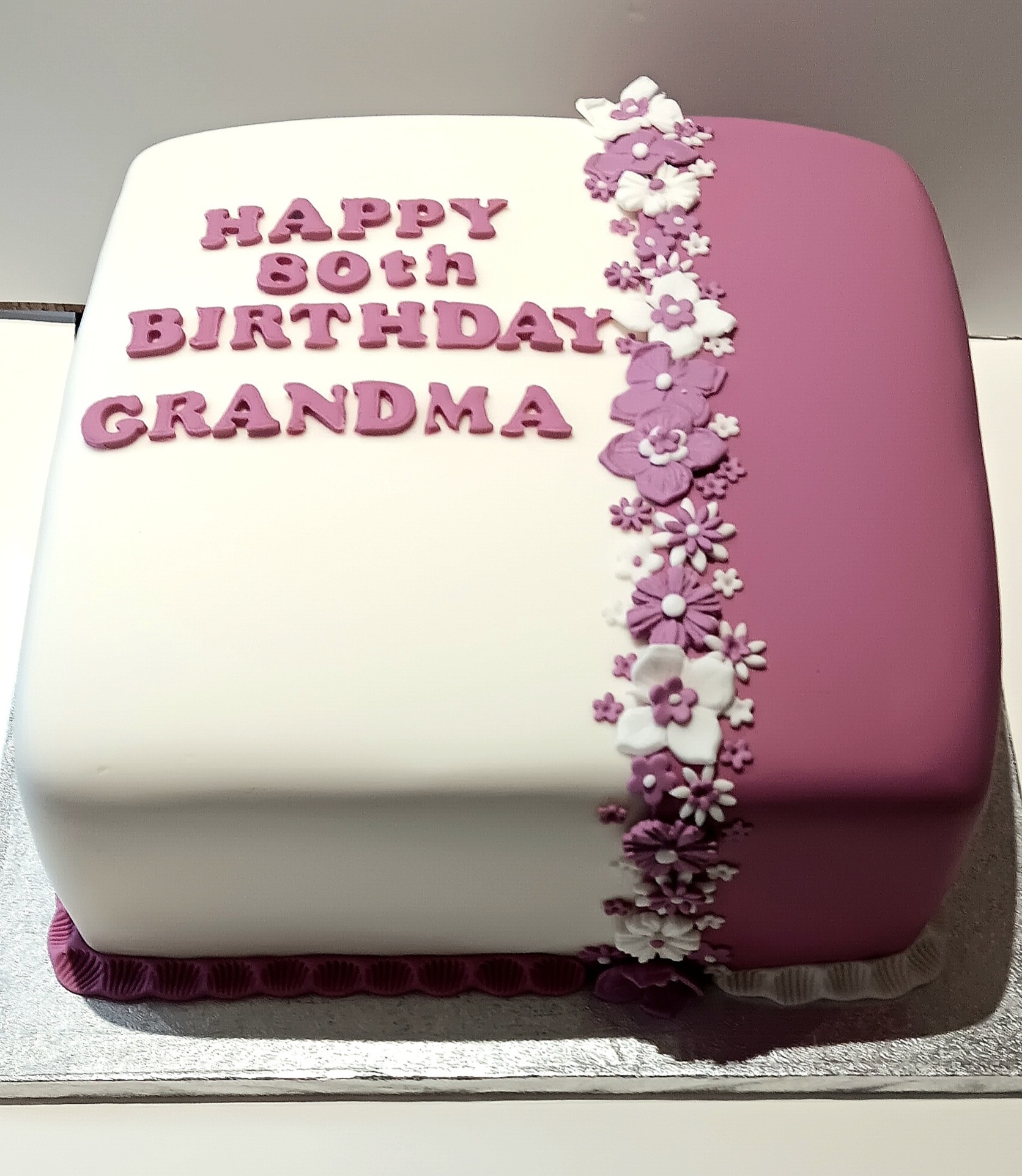 Large 12 inch pink and white 80th birthday cake