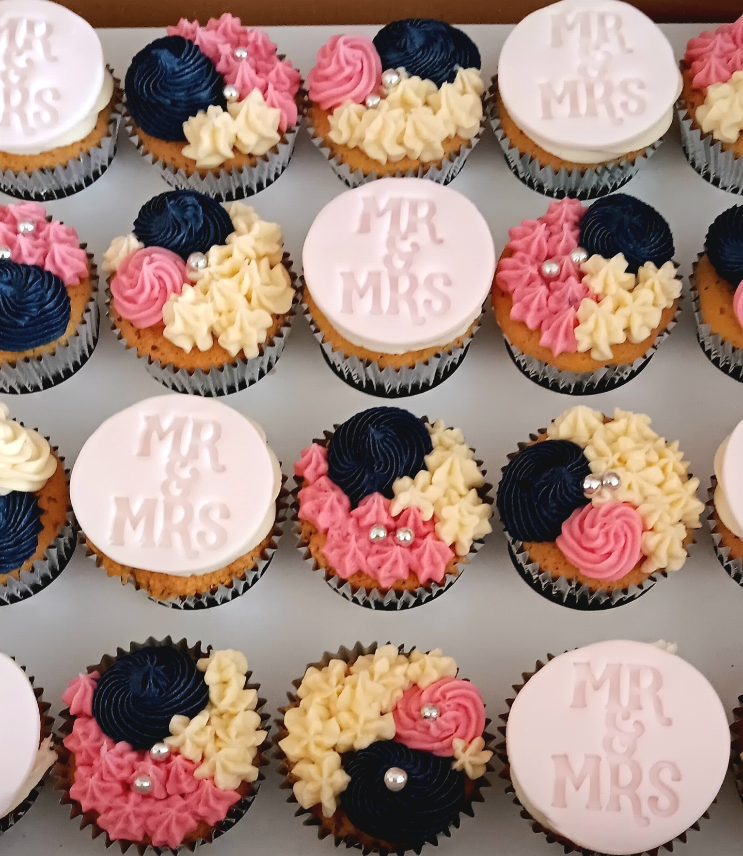 Pink and blue "Mrs and Mrs" wedding cupcakes